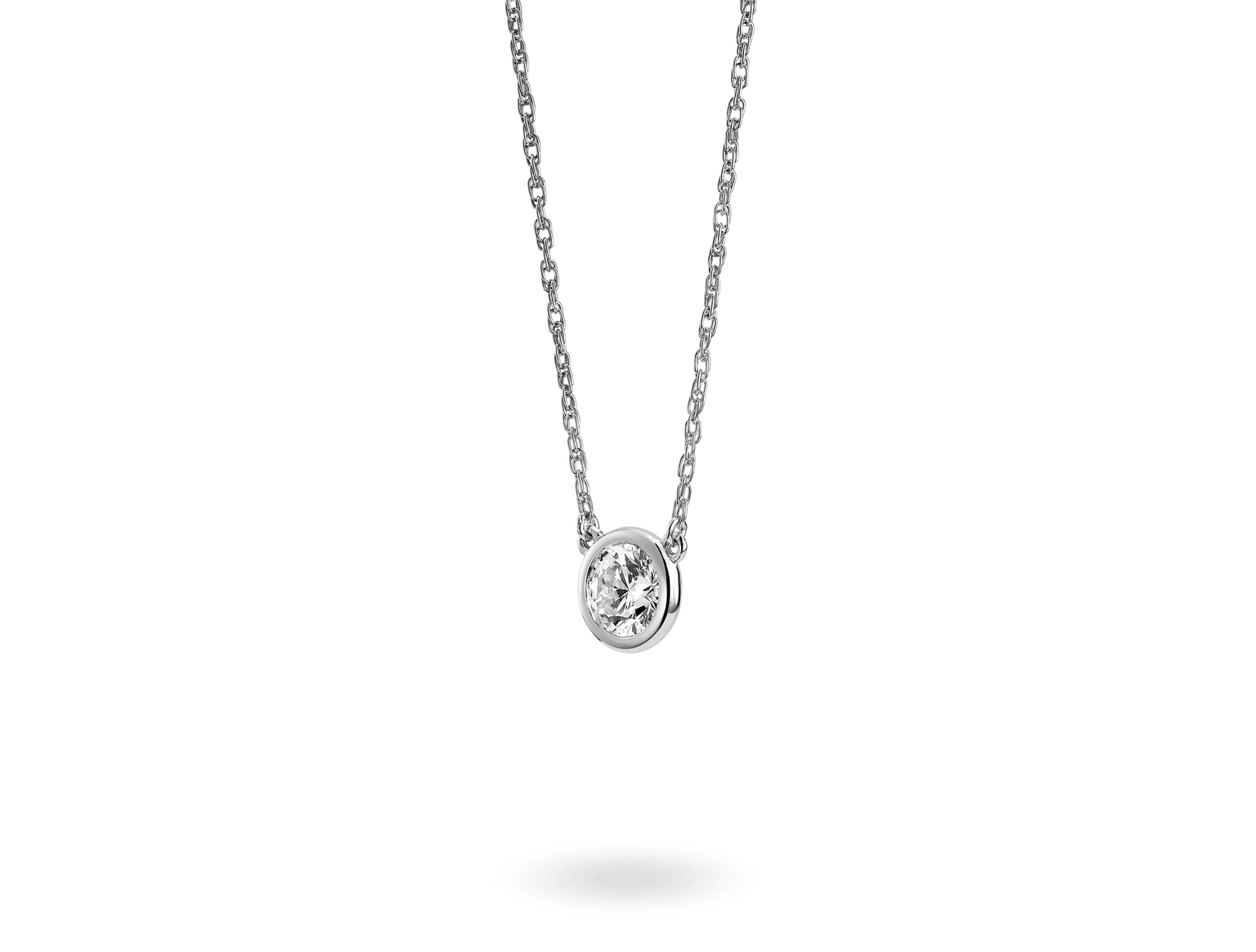 Side view of Lightbox Basics sterling silver 1/2 carat round brilliant bezel pendant with white diamond