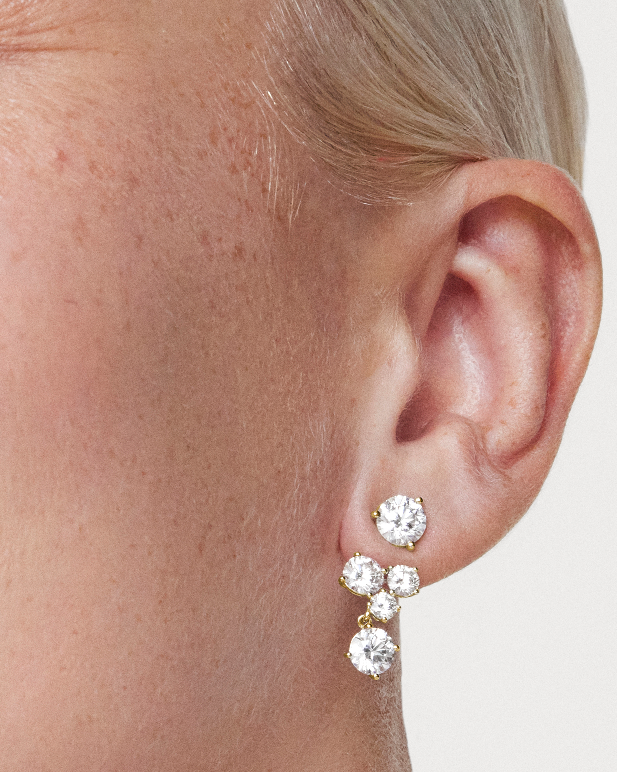 The Round Brilliant Solitaire Cluster Ear Jacket