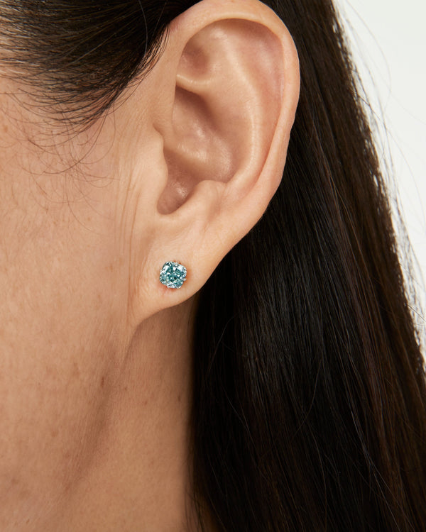 Model image of blue 1.5ct cushion cut studs in white gold