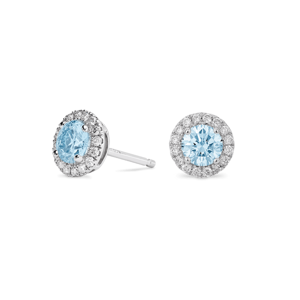 Side view of blue 1 carat total weight round brilliant halo studs