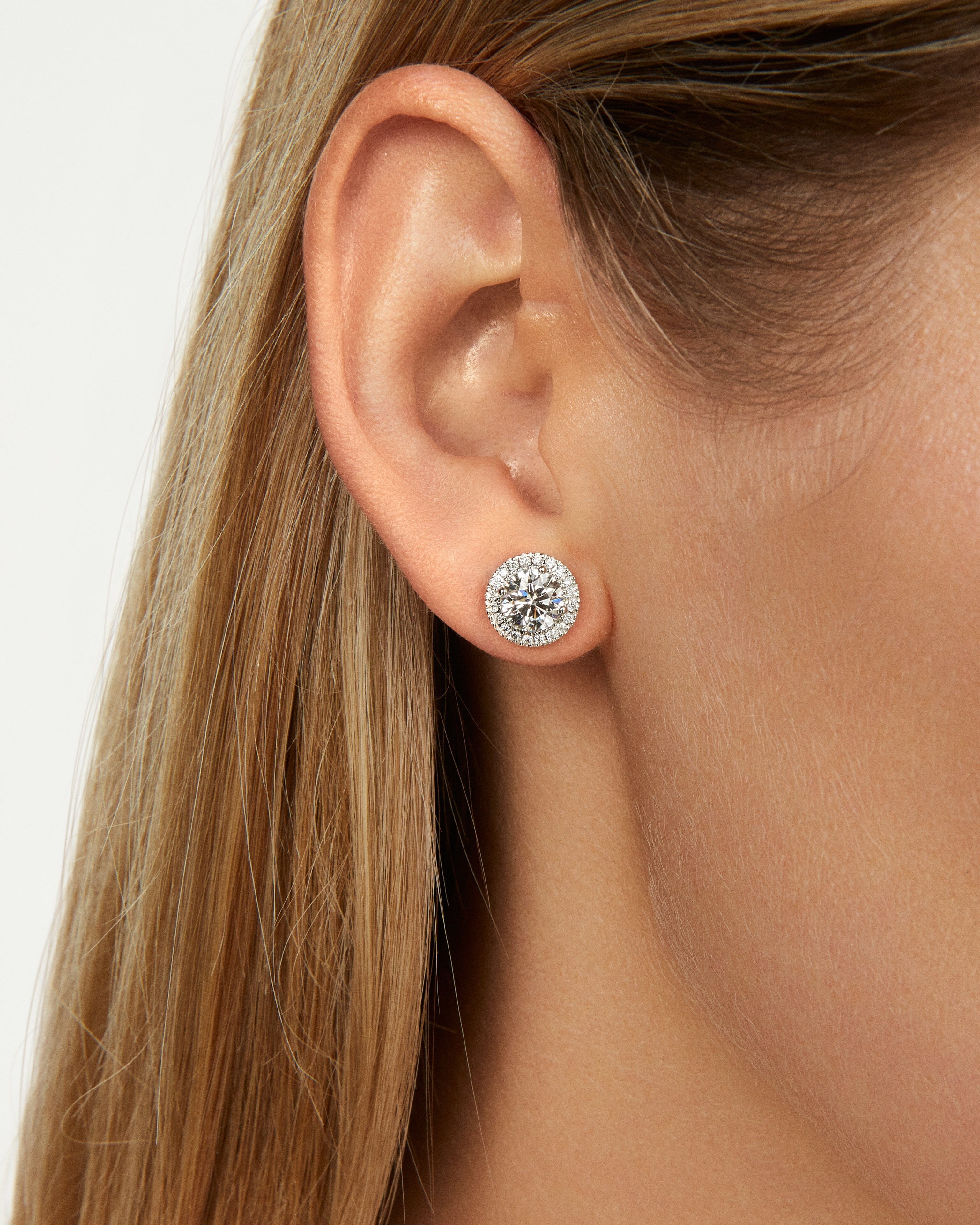 Model image of of 2 carat total weight round brilliant halo studs