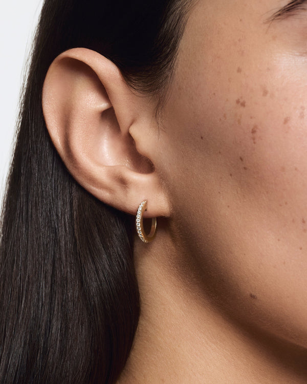 Model image of medium pave hoops in yellow gold