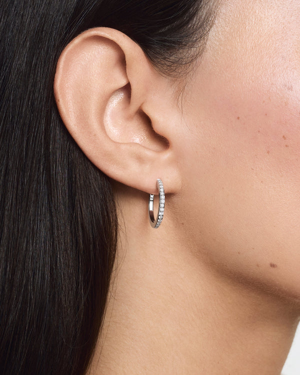 Model image of the large pave hoops in white gold