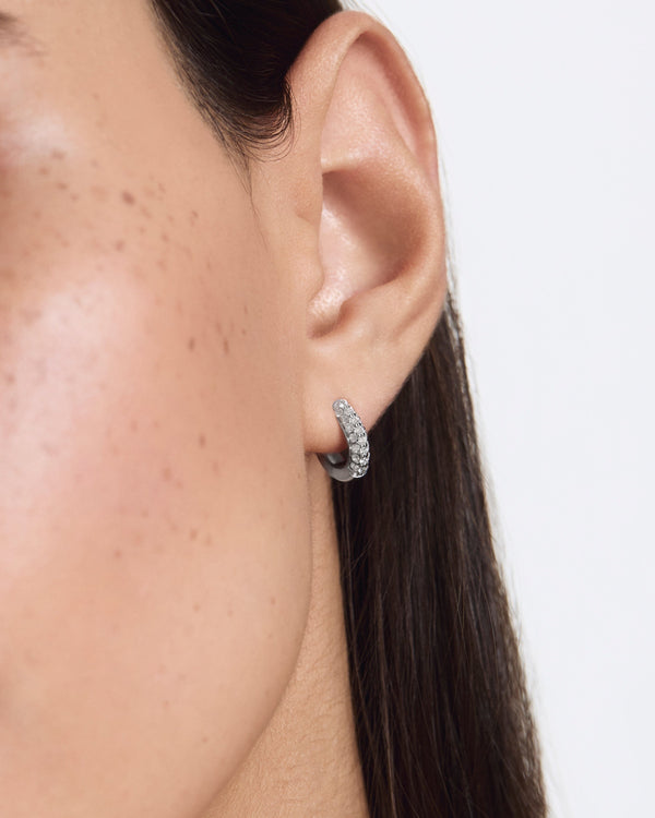 Model image of the pave bubble hoops in white gold