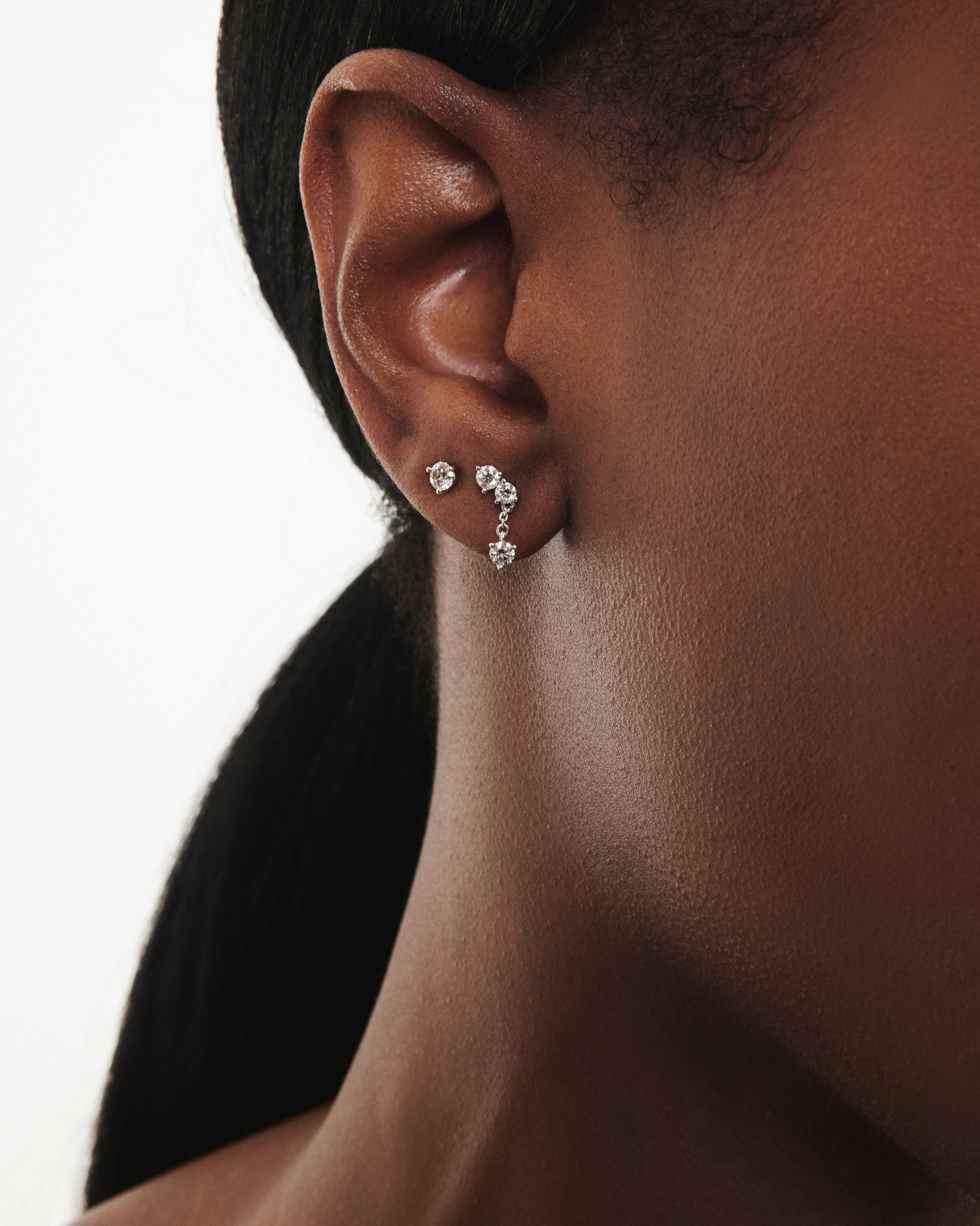 Model image of mini angle drop earring in white gold