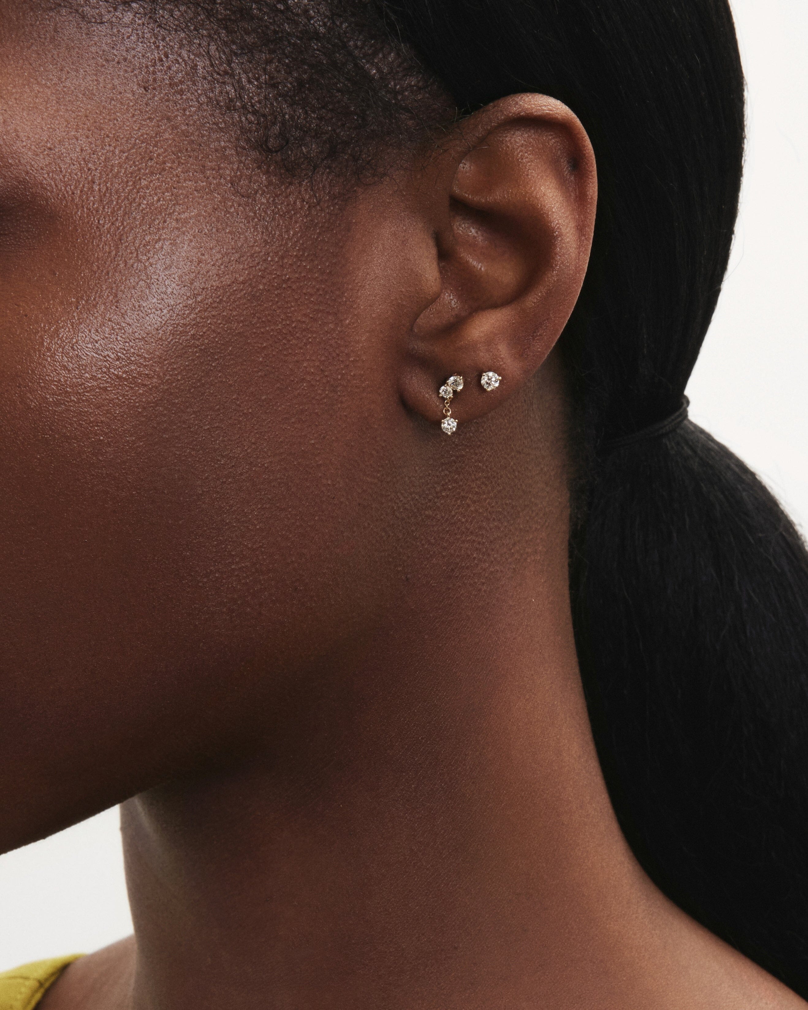 Model image of the mini angle drop earring in yellow gold