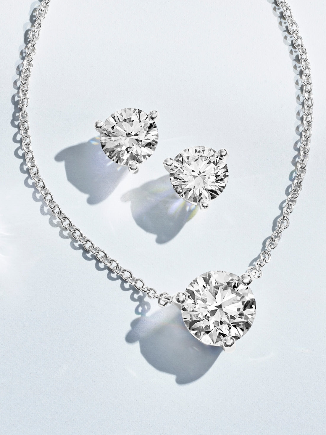 Round brilliant white lab-grown diamond earrings and pendant set