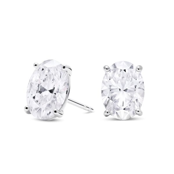 Side view of 3 carat total weight, oval cut solitaire studs in white gold