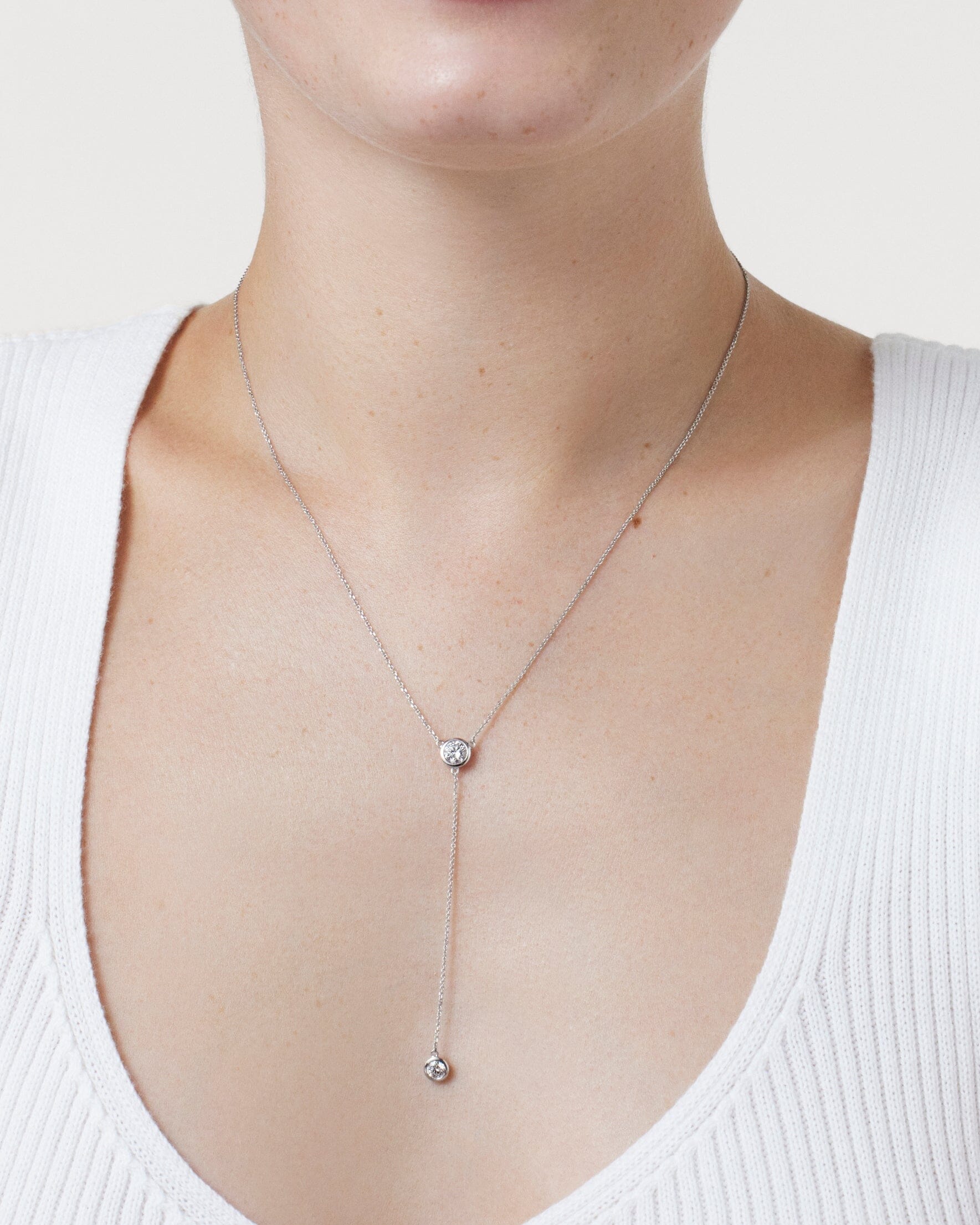 Model image of white gold 0.75 carat total weight bezel lariat pendant