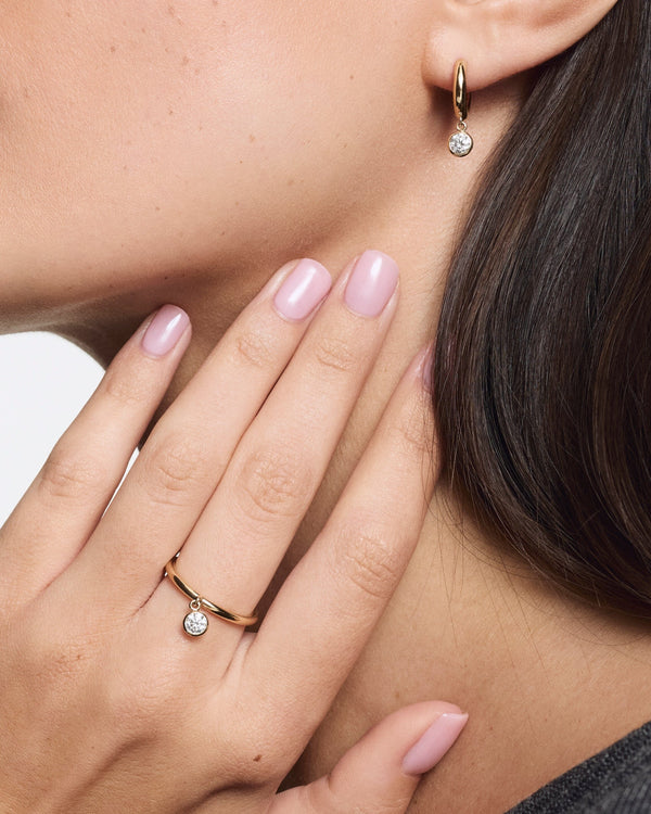 Model image of yellow gold wistful ring and wistful hoops