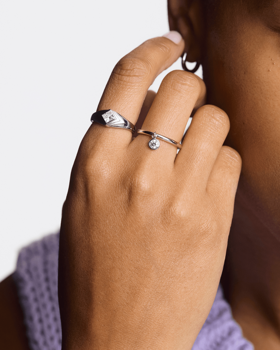 Model image of white gold recollection ring and wistful ring