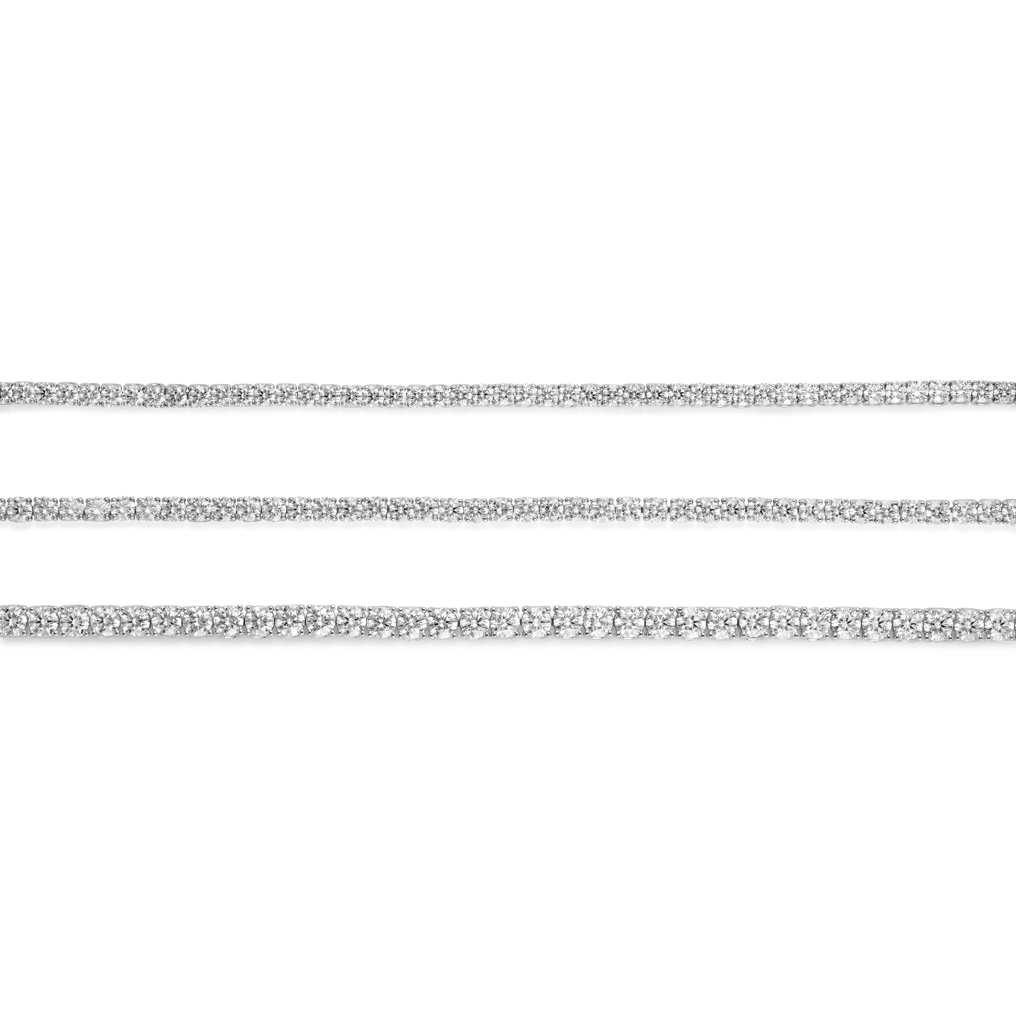 Group shot of white gold tennis bracelets to show comparison of small, medium and large diamond size