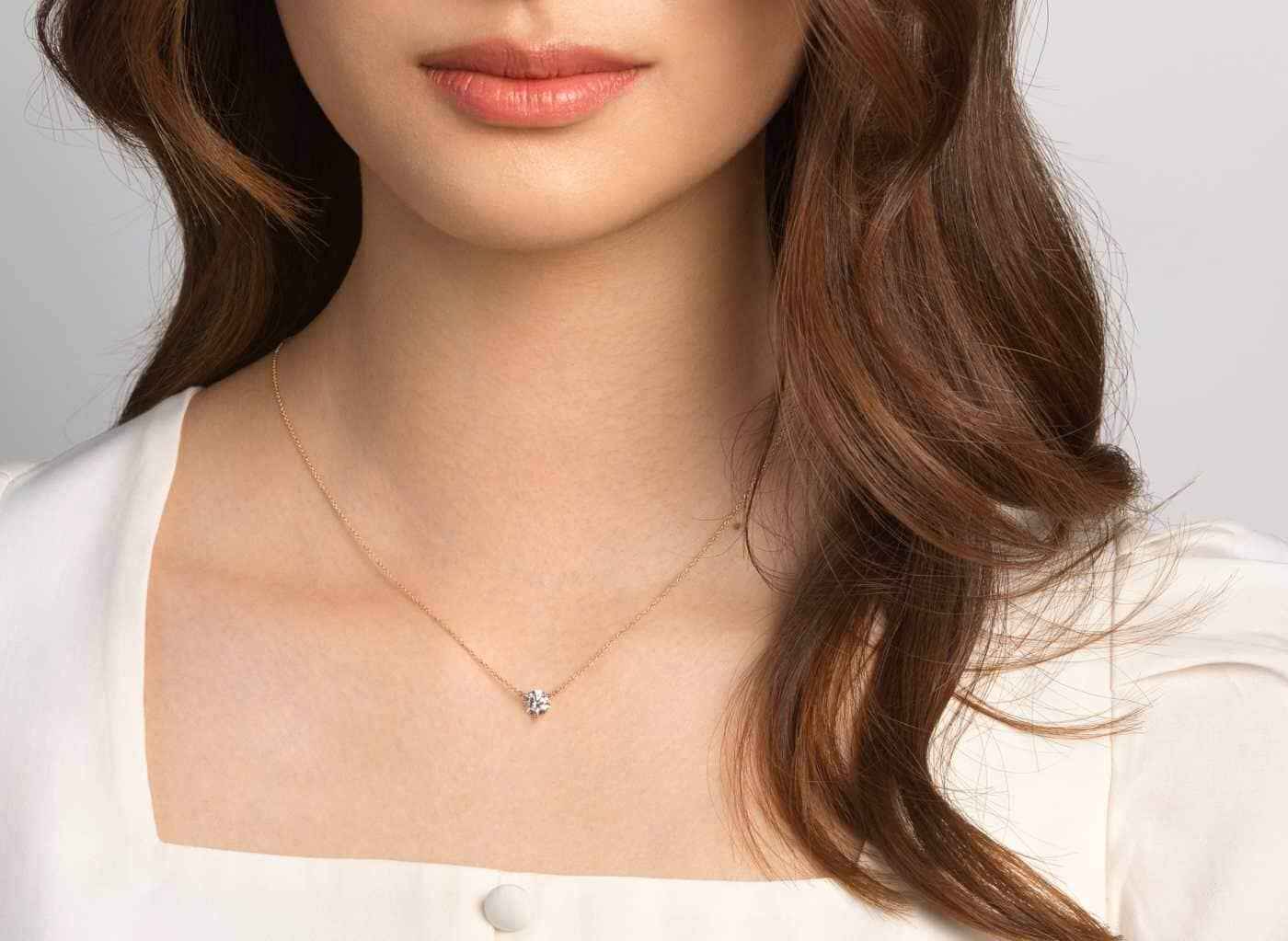 On Modle view of Solitaire 1 carat pendant with white diamond with 10k yellow gold chain